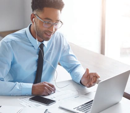 confident-businessman-working-his-laptop-001