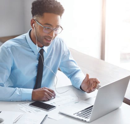 confident-businessman-working-his-laptop-001
